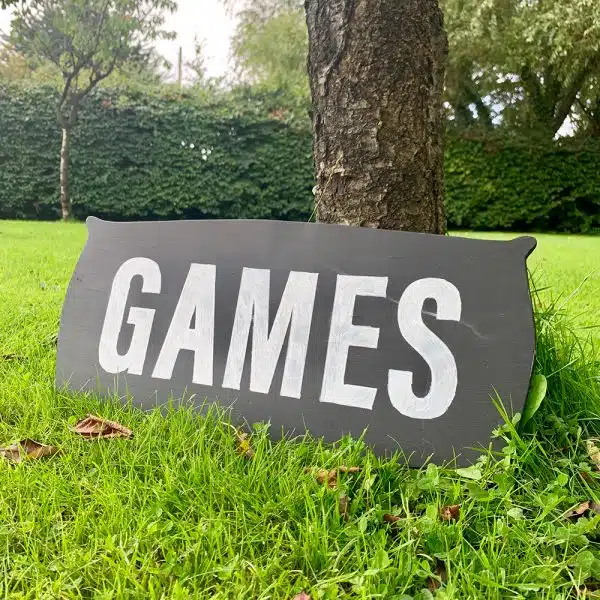 Lawn games to hire - a blackboard style sign with the word 'Games'